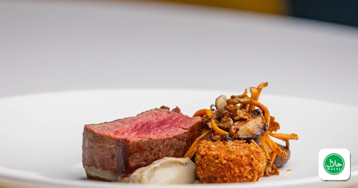 An elegant plated steak with mushrooms at a fine-dining restaurant