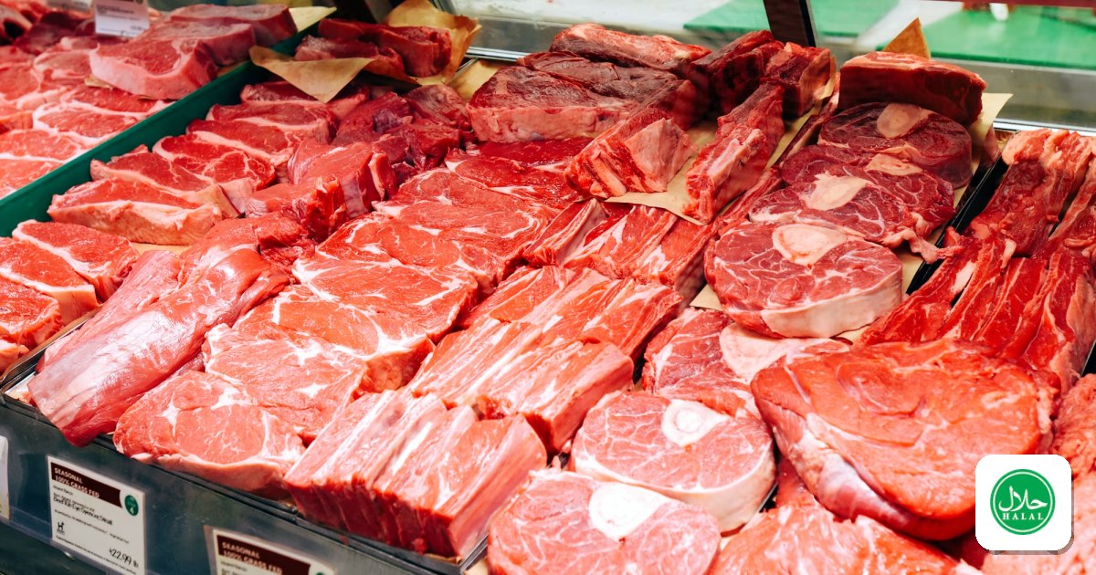 Fresh cuts of beef laid out in a butcher shop display case