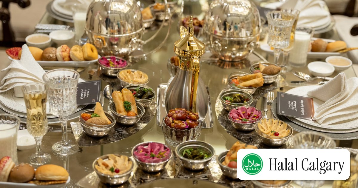 An iftar table set with dates, samosas and small shared plates