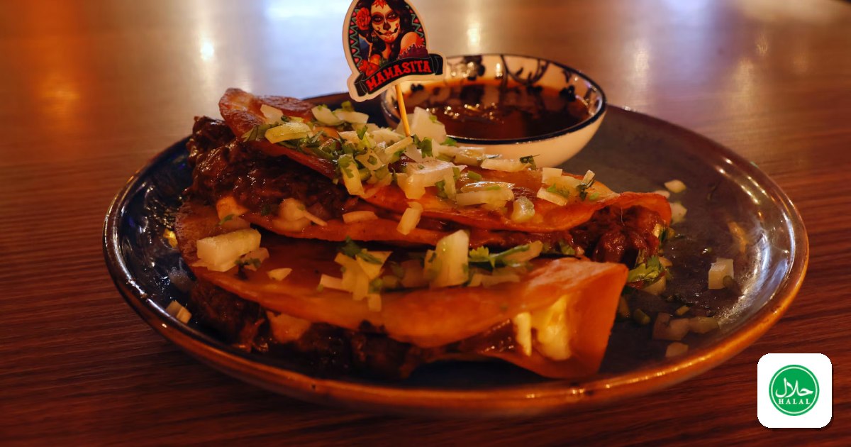 Birria tacos with consomme, a Mexican street food specialty