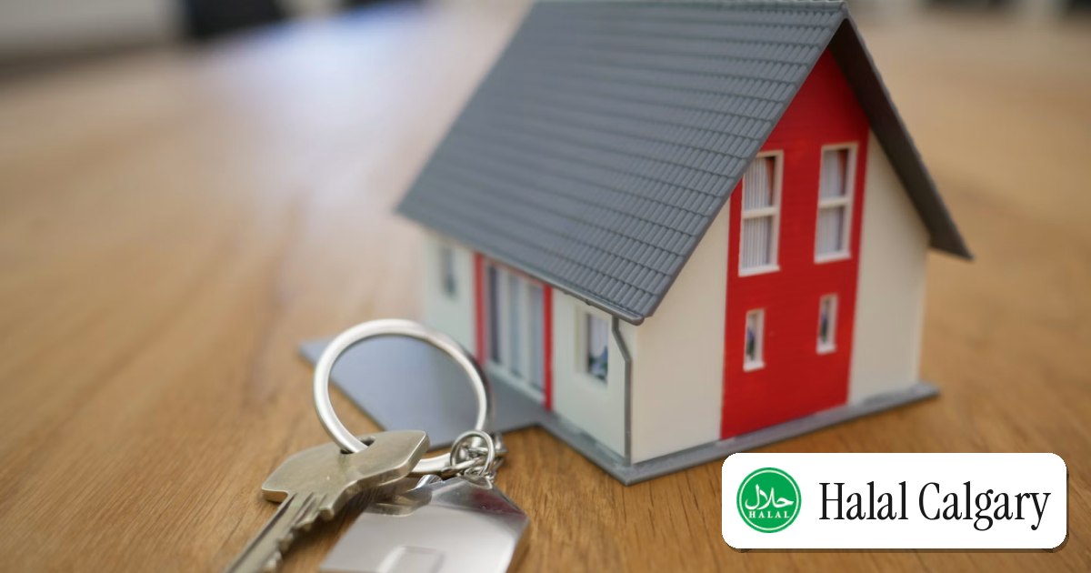 House keys held in front of a home