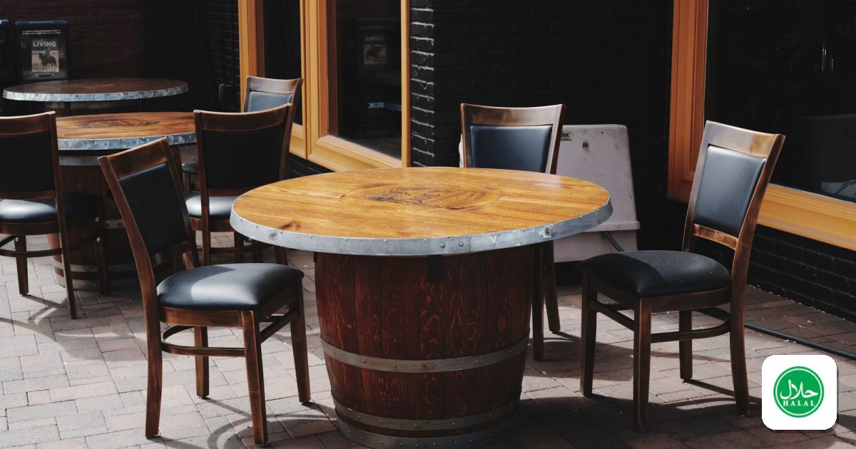 Sunlit patio tables and chairs outside a restaurant storefront