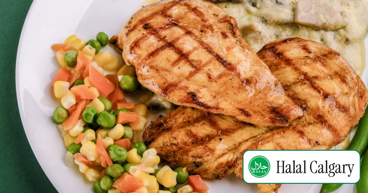 Flame-grilled chicken breasts with grill marks on a plate