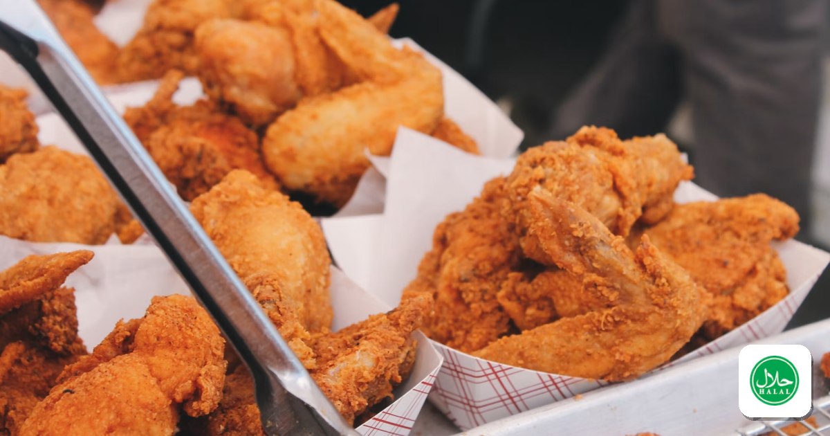 Pieces of golden fried chicken on brown paper